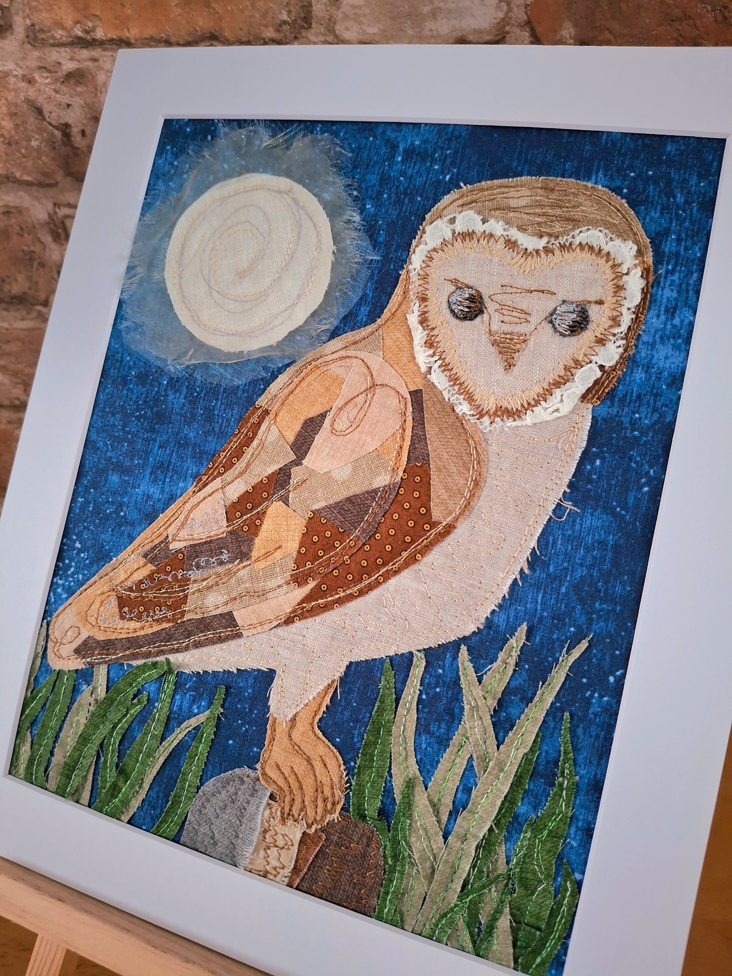 Artistic depiction of an owl created with fabric.