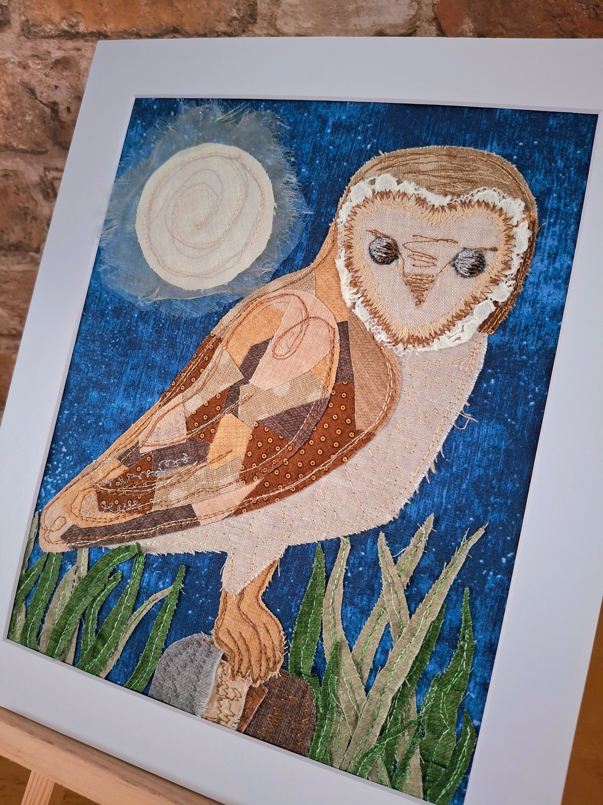 Artistic depiction of an owl created with fabric.
